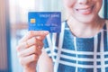 Business woman hand holds a blue credit card Royalty Free Stock Photo