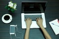 Business woman hand on notebook computer and cellphone