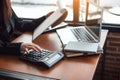 Business woman hand pressing on calculator for calculating cost estimating Royalty Free Stock Photo