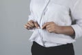 Business woman hand shirt button