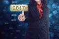 Business woman hand touching 2017 icon number Royalty Free Stock Photo