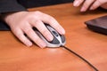 Business woman hand working on a computer mouse at Royalty Free Stock Photo