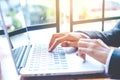 Business woman hand is working on a laptop computer in an office Royalty Free Stock Photo