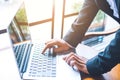 Business woman hand is working on a laptop computer in an office Royalty Free Stock Photo