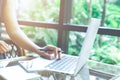 Business woman hand working with a laptop computer in the office Royalty Free Stock Photo