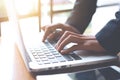 Business woman hand is working on a laptop computer in an office Royalty Free Stock Photo