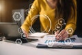 .business woman hand working with laptop computer, tablet and smart phone in office with digital marketing media  in virtual icon Royalty Free Stock Photo