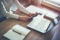 Business woman hand working laptop computer on wooden desk. Royalty Free Stock Photo