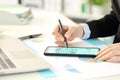 Business woman hands checking graphs on phone