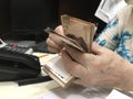 Woman hands counting a stack of mexican peso 500 money bills Royalty Free Stock Photo