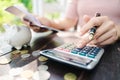 Business woman hands holding saving account passbook with calculator, account and saving concept Royalty Free Stock Photo