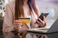 Business woman hands using smartphone and holding credit card as Online shopping Royalty Free Stock Photo