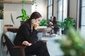 Business woman happy talking mobile phone in office spaces