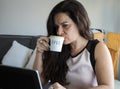 Business woman having coffee at home office desk Royalty Free Stock Photo