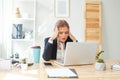 Business woman having headache at office Royalty Free Stock Photo