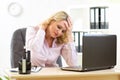 Business woman with headache having stress in the office Royalty Free Stock Photo