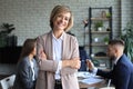 Business woman with her staff, people group in background at modern bright office indoors Royalty Free Stock Photo