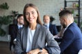 Business woman with her staff, people group in background at modern bright office indoors Royalty Free Stock Photo