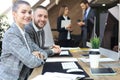 Business woman with her staff, people group in background at modern bright office indoors Royalty Free Stock Photo