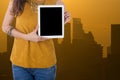 business woman hold computer tablet with with building in background Royalty Free Stock Photo