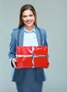 Business woman hold gift. Beautiful girl business suit dressed.