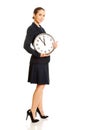 Business woman holding big clock. Royalty Free Stock Photo