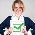 Business woman holding blank paper with check Royalty Free Stock Photo