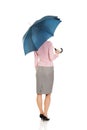 Business woman is holding blue umbrella. Royalty Free Stock Photo