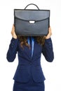 Business woman holding briefcase in front of face Royalty Free Stock Photo