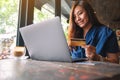 A business woman holding credit card while using laptop computer Royalty Free Stock Photo