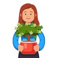 Business woman holding flower pot with money tree Royalty Free Stock Photo