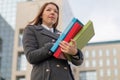 Business woman holding folders with documents outdoors Royalty Free Stock Photo