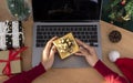 Business woman holding giftbox on office table in Christmas day Royalty Free Stock Photo