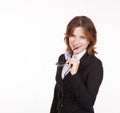 Business woman holding glasses in mouth Royalty Free Stock Photo