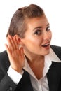 Business woman holding hand at ear and eavesdrop Royalty Free Stock Photo