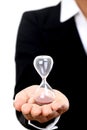 Business woman holding hourglass Royalty Free Stock Photo