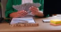 Business woman holding many of dollars and the text is persistance