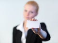 Business woman holding out a business card Royalty Free Stock Photo