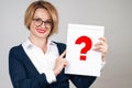 Business woman holding paper with question mark Royalty Free Stock Photo