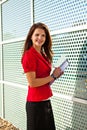 Business woman holding papers and writing Royalty Free Stock Photo