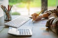 Business woman holding pencil working with financial paperwork. Accounting and Saving concept