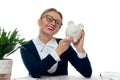 Business woman is holding piggy bank. Saving concept Royalty Free Stock Photo