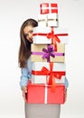 Business woman holding pile, stack, heap of presents
