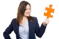 Business woman holding a puzzle piece Royalty Free Stock Photo