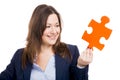 Business woman holding a puzzle piece Royalty Free Stock Photo