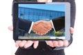 Business woman holding tablet with businesspeople handshake on s Royalty Free Stock Photo