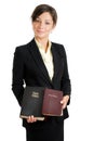 Business woman holding two bibles Royalty Free Stock Photo