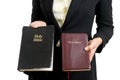 Business woman holding two bibles Royalty Free Stock Photo