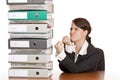 Business woman holds fists to file folder stack