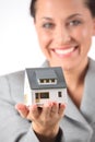 Business woman holds model of house Royalty Free Stock Photo